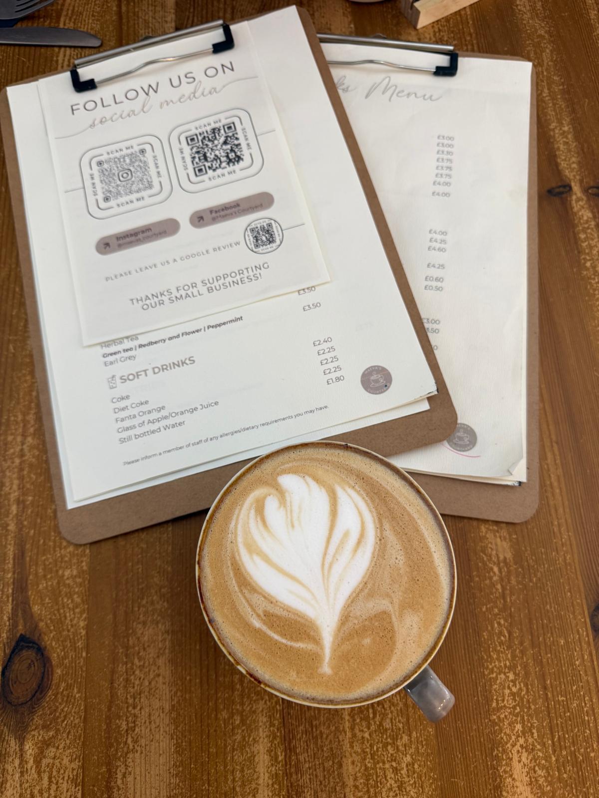 Latte art with menu on the table