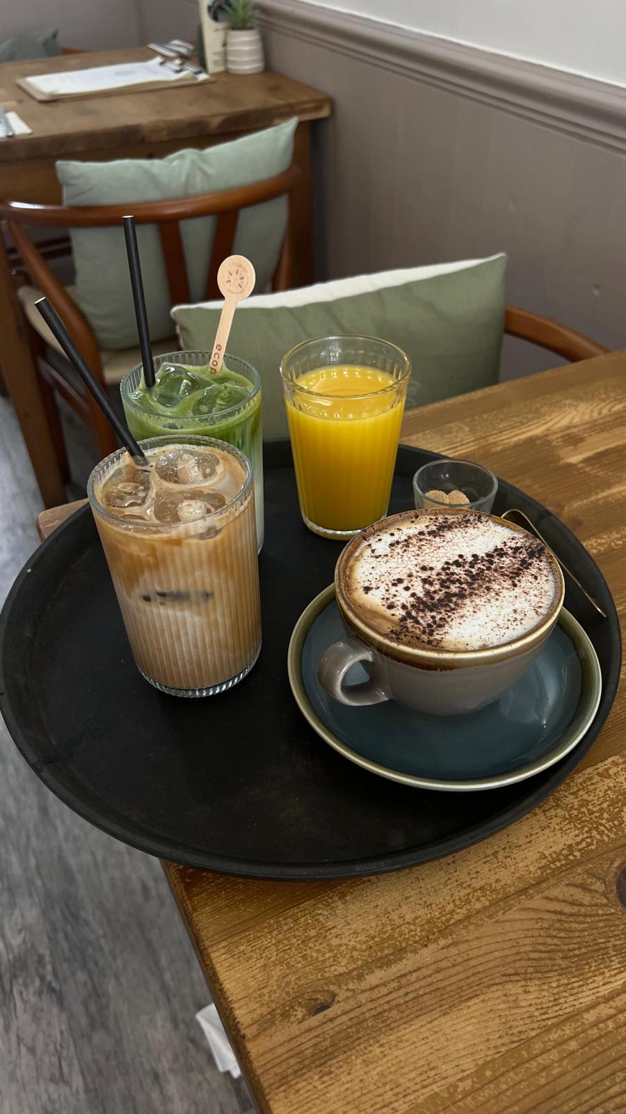Coffee tray with iced latte and juice