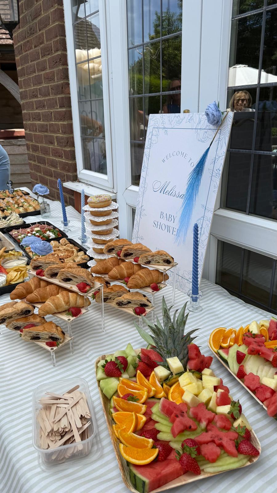 Baby shower spread with pastries and fruit
